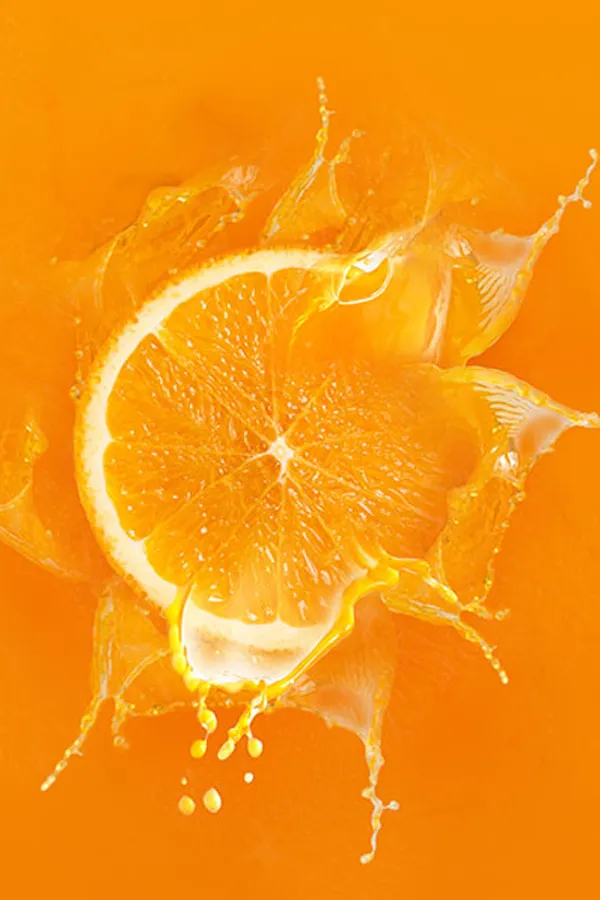 An orange slice exploding into juice. Get Hemealumen IV therapy from Shelley Cole, M.D. of Healthy Success in Temple, Texas.