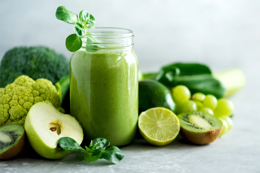 A tableau of healthy green fruits and vegetables and juices. Get nutritional counseling from Shelley Cole, M.D. of Healthy Success in Temple, Texas.