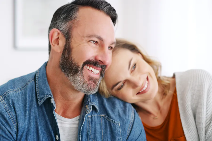 A smiling couple with healthy teeth. Schedule supportive dental therapy from Shelley Cole, M.D. of Healthy Success in Temple, Texas.