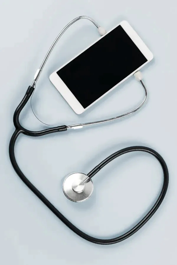 A smartphone with a stethoscope attached to it, symbolizing Telemedicine treatment from Shelley Cole, M.D. of Healthy Success in Temple, Texas.