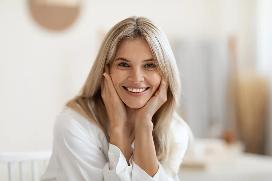 A smiling woman with beautiful teeth. Schedule Tooth Remineralization treatment from Shelley Cole, M.D. of Healthy Success in Temple, Texas.